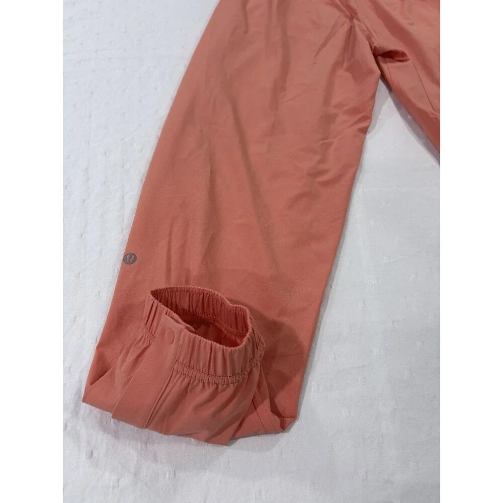 Lululemon Tear-Away Mid-Rise Track Pant Size 6 Coral Kiss Orange Swift LW5GAXS